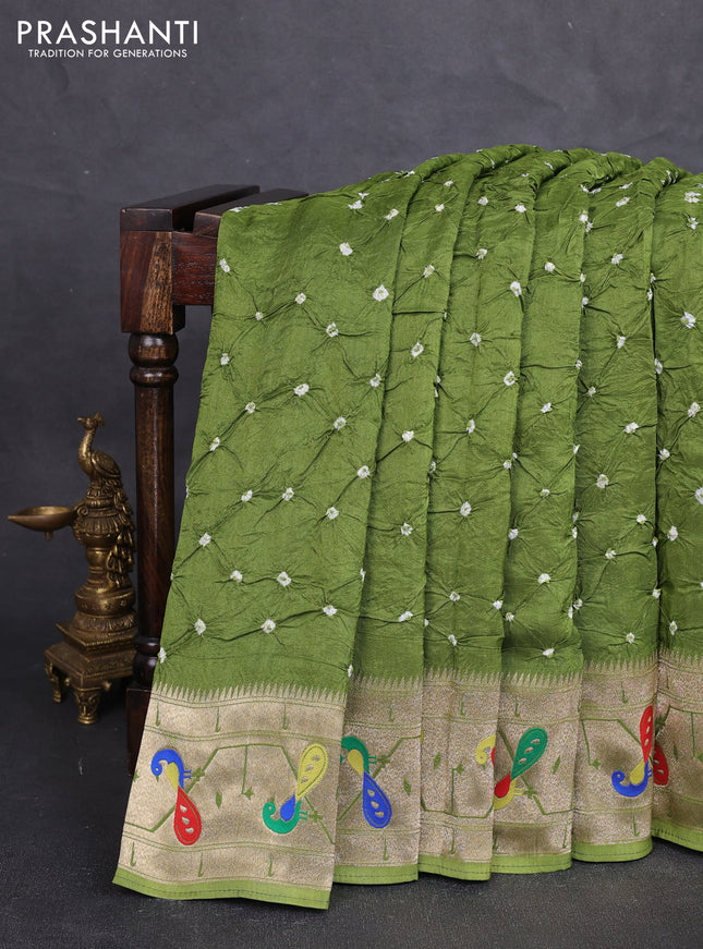 Dola silk saree light green with allover bandhani prints and paithani border