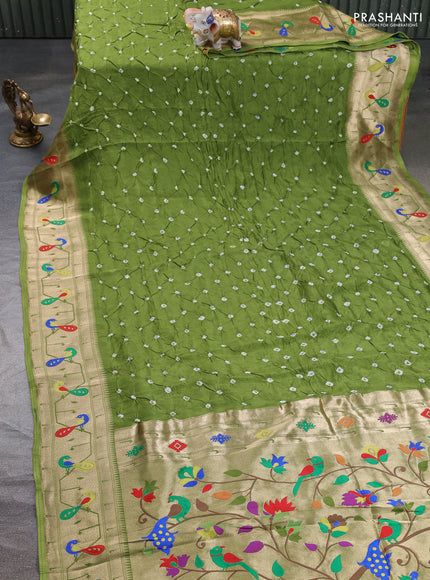 Dola silk saree light green with allover bandhani prints and paithani border