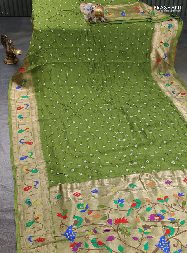 Dola silk saree light green with allover bandhani prints and paithani border