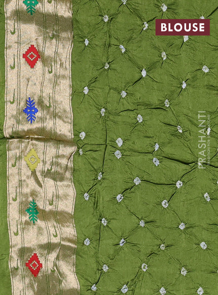 Dola silk saree light green with allover bandhani prints and paithani border