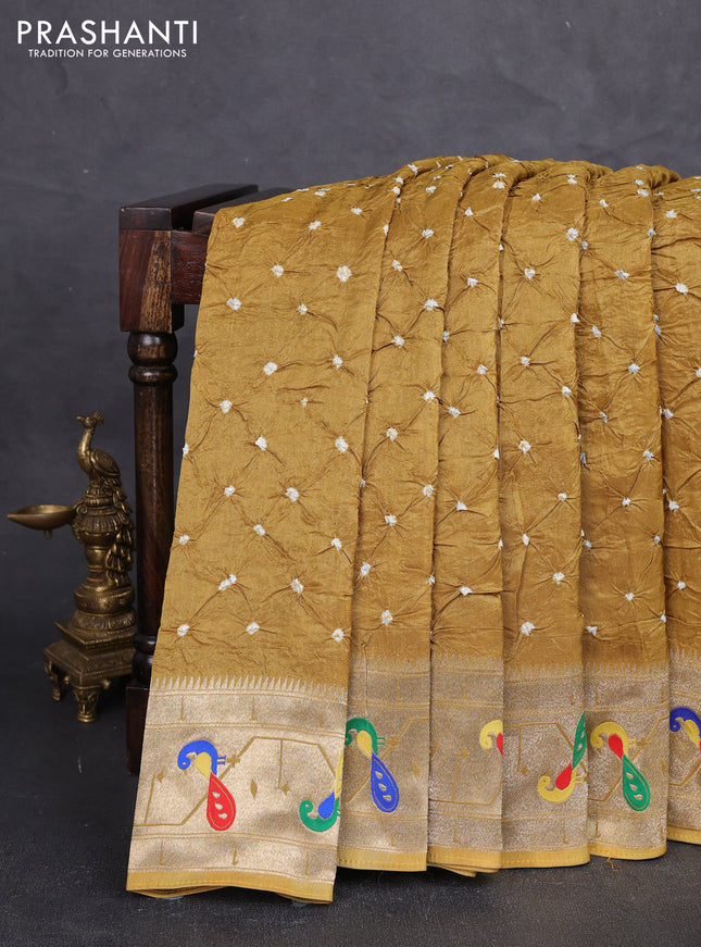 Dola silk saree dark mustard with allover bandhani prints and paithani border