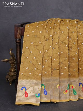 Dola silk saree dark mustard with allover bandhani prints and paithani border