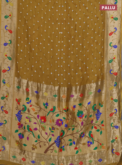 Dola silk saree dark mustard with allover bandhani prints and paithani border