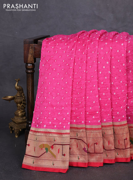 Dola silk saree light pink and red with allover bandhani prints and paithani border