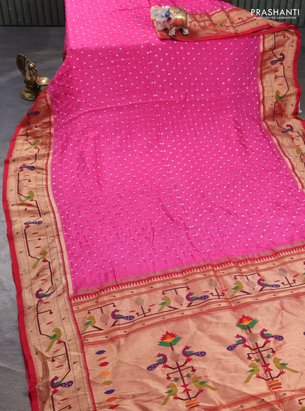 Dola silk saree light pink and red with allover bandhani prints and paithani border