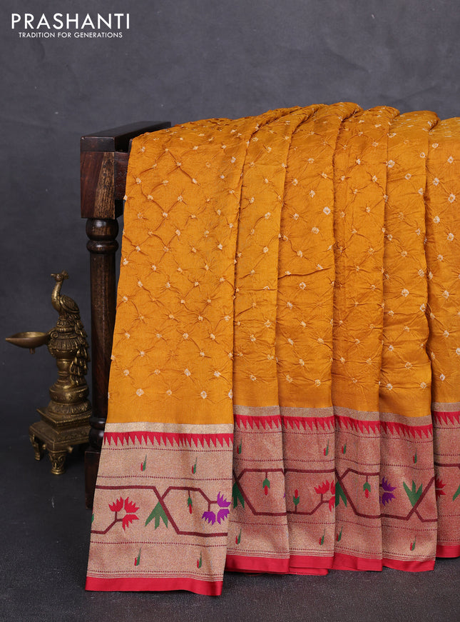 Dola silk saree mustard yellow and red with allover bandhani prints and paithani border