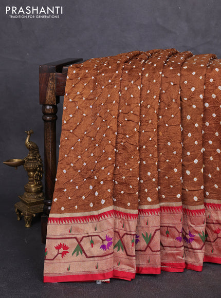 Dola silk saree dark mustard shade and red with allover bandhani prints and paithani border