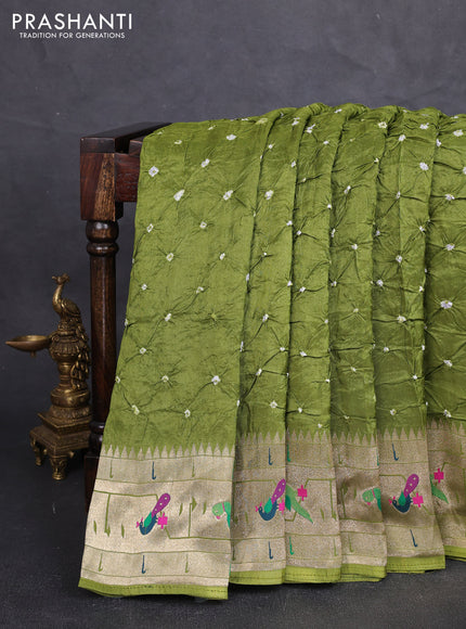 Dola silk saree light green with allover bandhani prints and paithani border