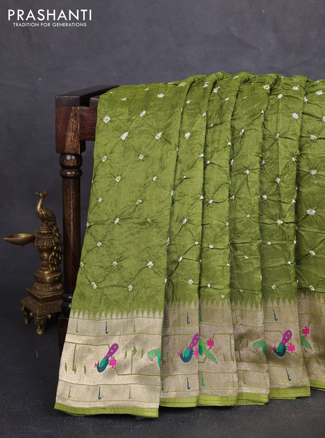 Dola silk saree light green with allover bandhani prints and paithani border
