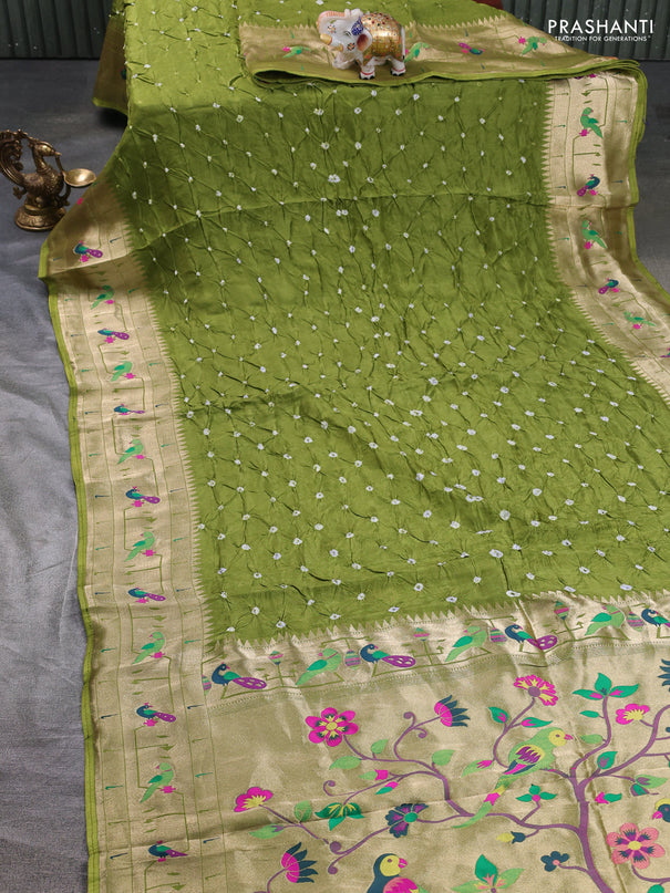 Dola silk saree light green with allover bandhani prints and paithani border