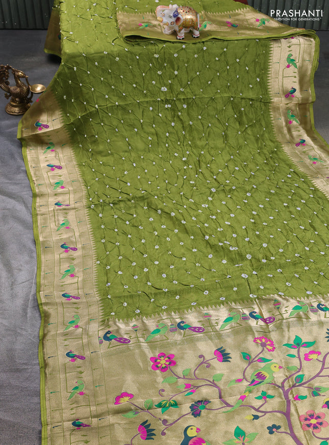 Dola silk saree light green with allover bandhani prints and paithani border