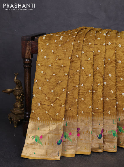 Dola silk saree dark mustard yellow with allover bandhani prints and paithani border