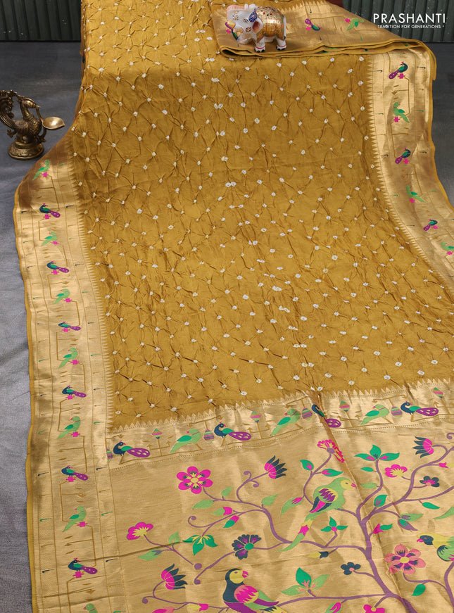 Dola silk saree dark mustard yellow with allover bandhani prints and paithani border