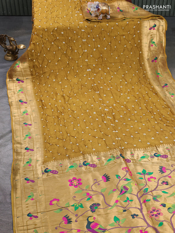 Dola silk saree dark mustard yellow with allover bandhani prints and paithani border