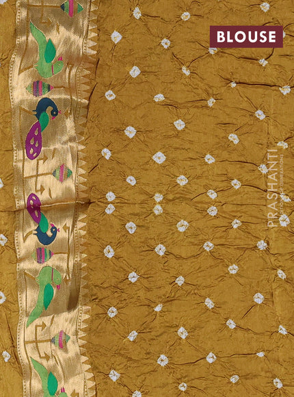 Dola silk saree dark mustard yellow with allover bandhani prints and paithani border