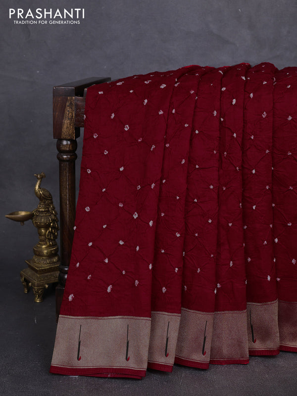 Dola silk saree red with allover bandhani prints and muniya butta border