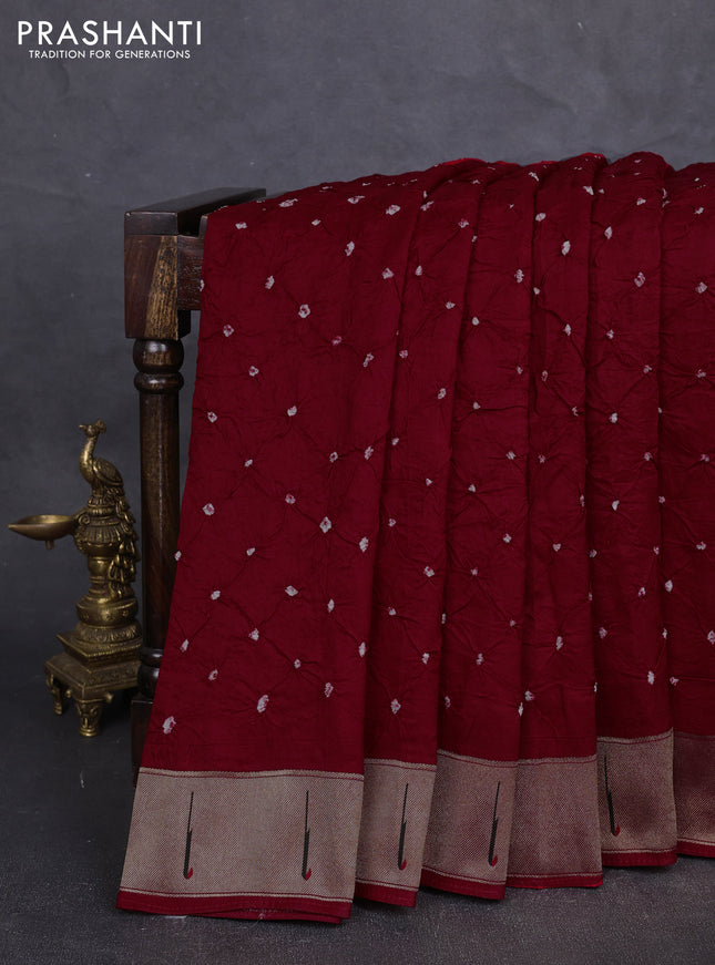 Dola silk saree red with allover bandhani prints and muniya butta border
