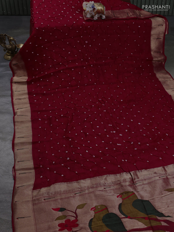 Dola silk saree red with allover bandhani prints and muniya butta border