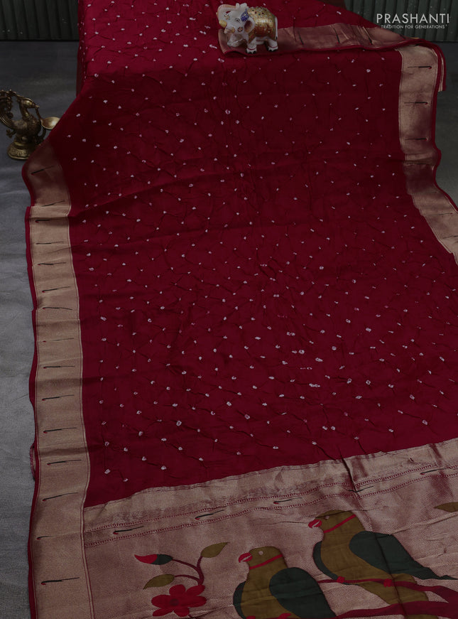 Dola silk saree red with allover bandhani prints and muniya butta border