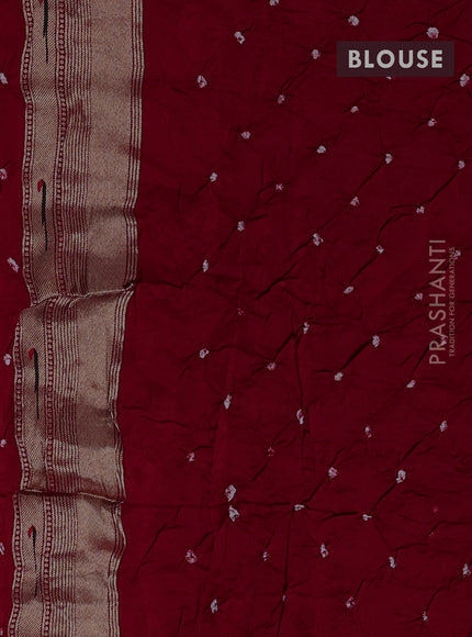 Dola silk saree red with allover bandhani prints and muniya butta border