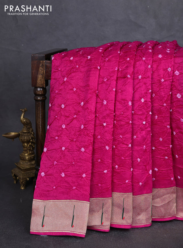Dola silk saree dark pink with allover bandhani prints and muniya butta border