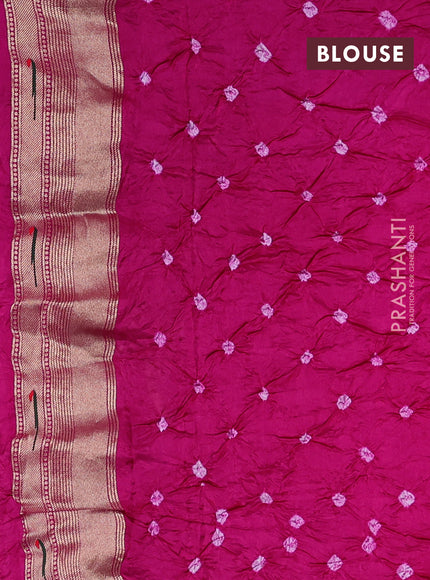 Dola silk saree dark pink with allover bandhani prints and muniya butta border