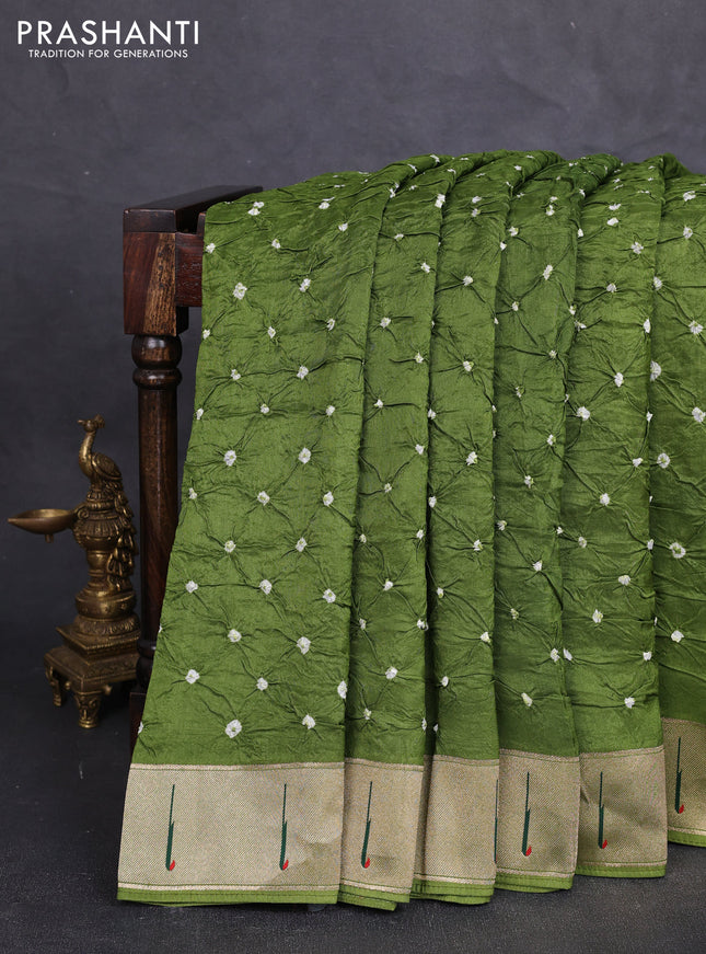 Dola silk saree green shade with allover bandhani prints and muniya butta border
