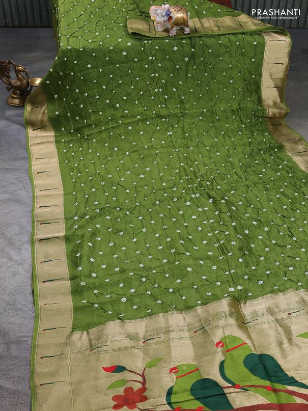 Dola silk saree green shade with allover bandhani prints and muniya butta border