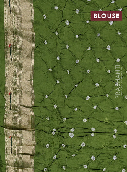 Dola silk saree green shade with allover bandhani prints and muniya butta border