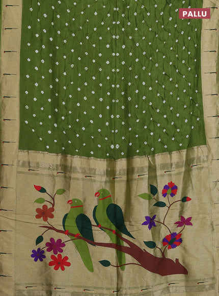 Dola silk saree green shade with allover bandhani prints and muniya butta border