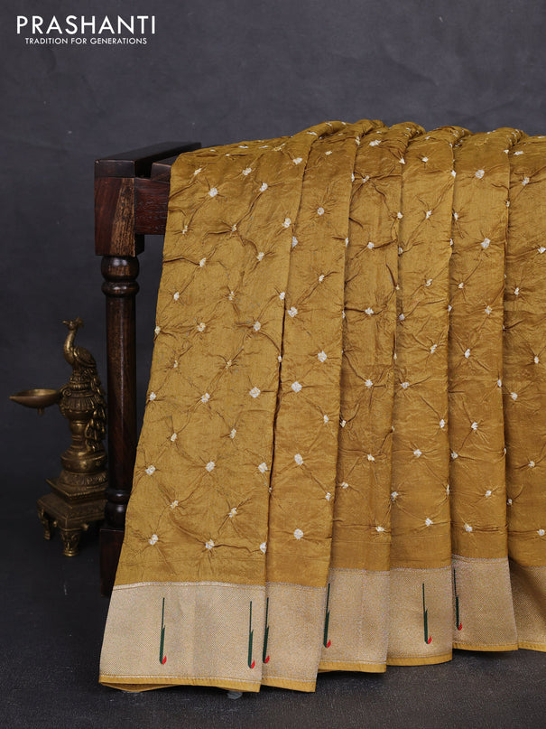 Dola silk saree dark mustard yellow with allover bandhani prints and muniya butta border