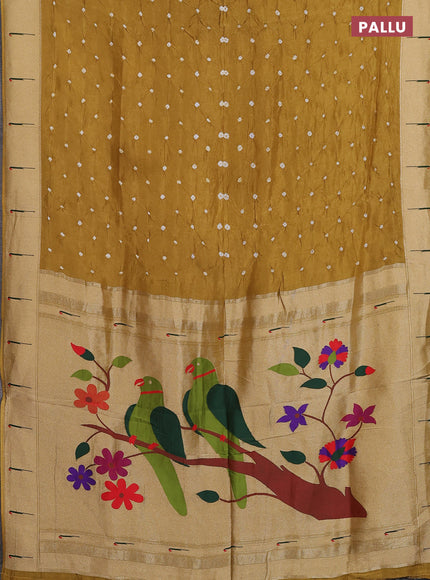 Dola silk saree dark mustard yellow with allover bandhani prints and muniya butta border