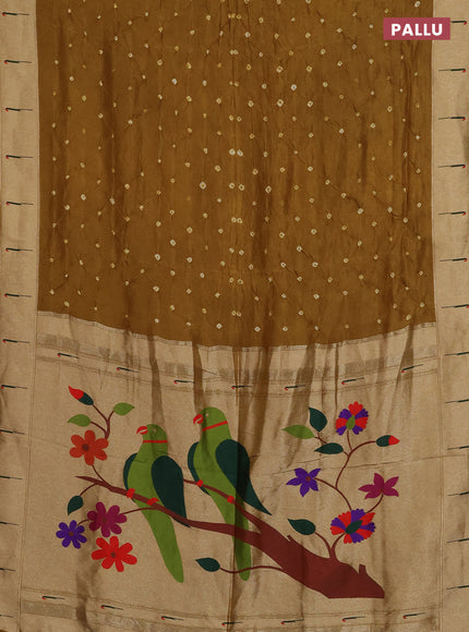 Dola silk saree dark mustard with allover bandhani prints and muniya butta border