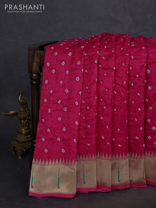 Dola silk saree pink with allover bandhani prints and muniya butta border