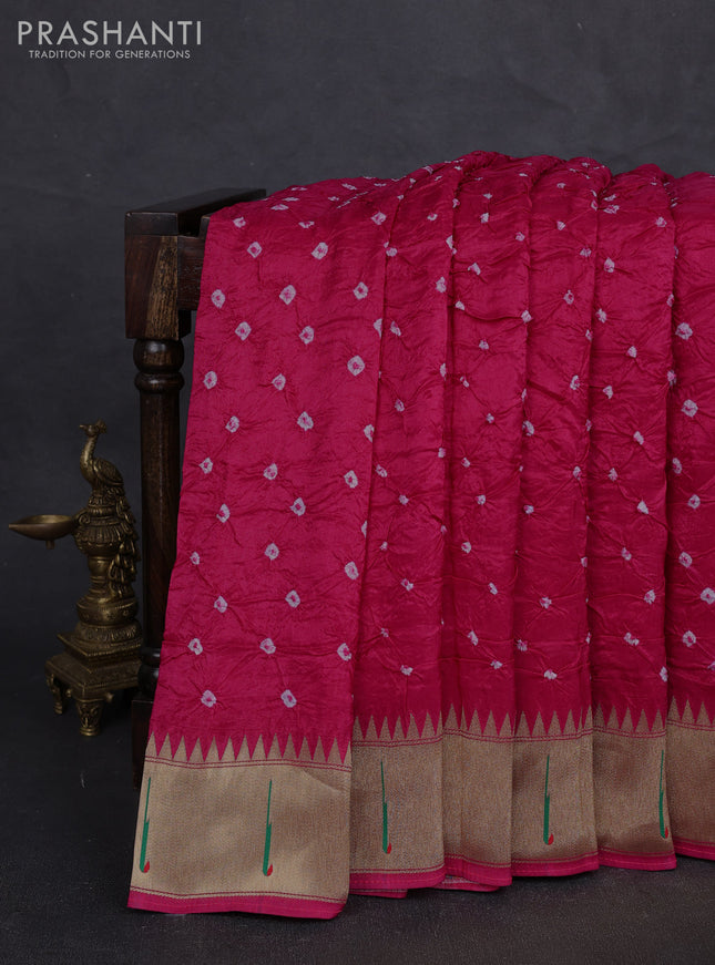 Dola silk saree pink with allover bandhani prints and muniya butta border