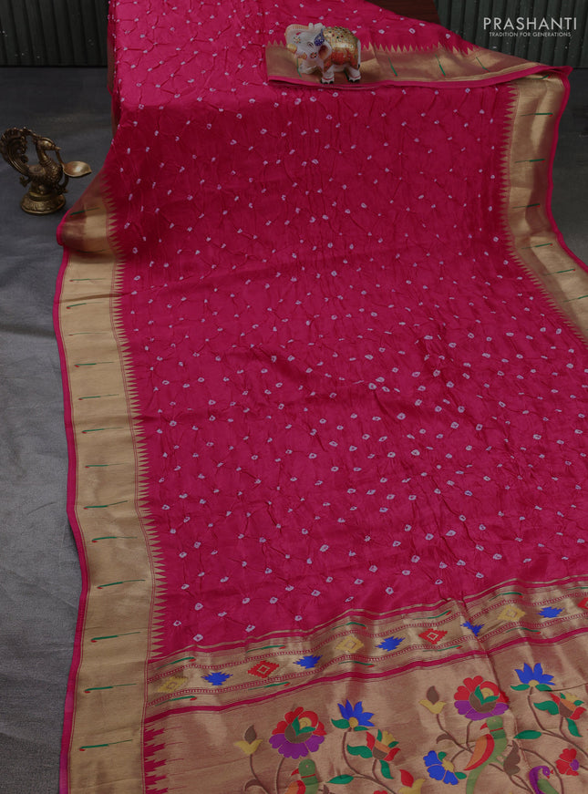 Dola silk saree pink with allover bandhani prints and muniya butta border