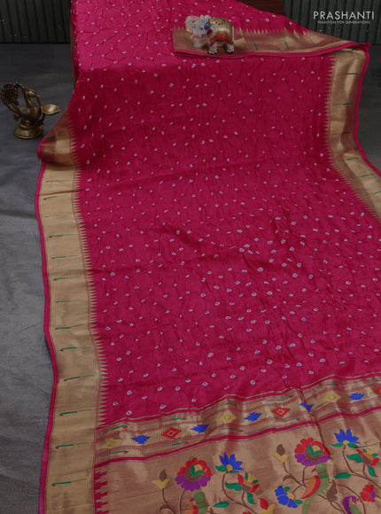 Dola silk saree pink with allover bandhani prints and muniya butta border