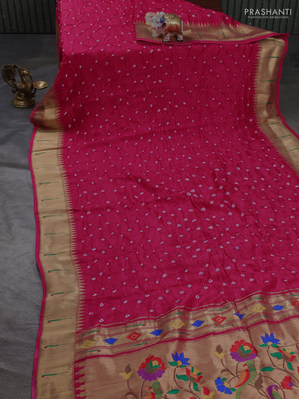 Dola silk saree pink with allover bandhani prints and muniya butta border