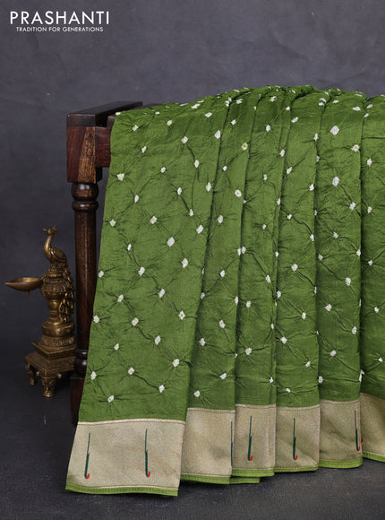 Dola silk saree sap green with allover bandhani prints and muniya butta border
