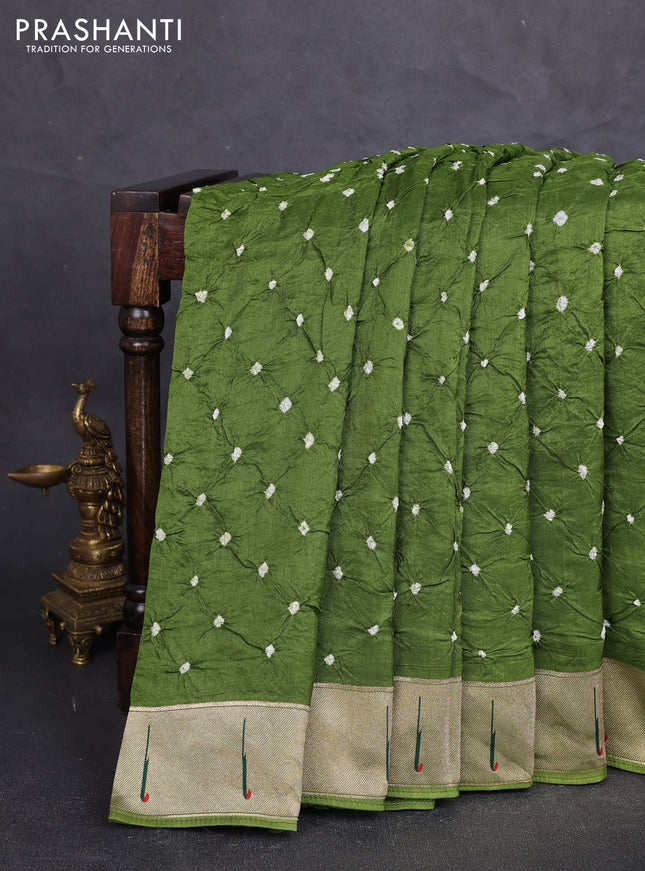 Dola silk saree sap green with allover bandhani prints and muniya butta border