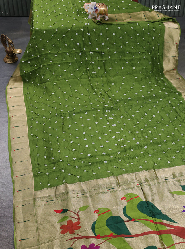 Dola silk saree sap green with allover bandhani prints and muniya butta border