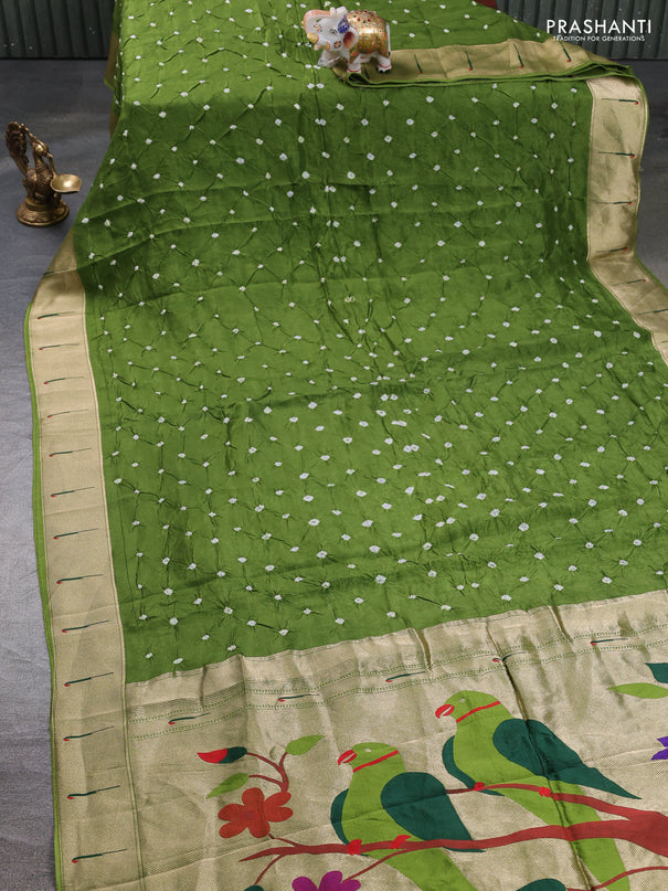 Dola silk saree sap green with allover bandhani prints and muniya butta border
