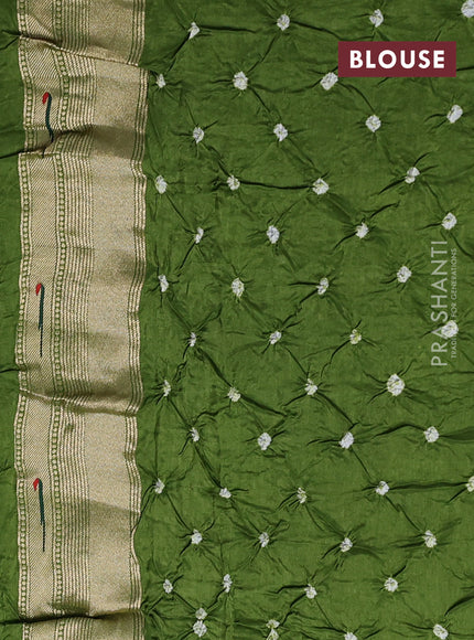 Dola silk saree sap green with allover bandhani prints and muniya butta border