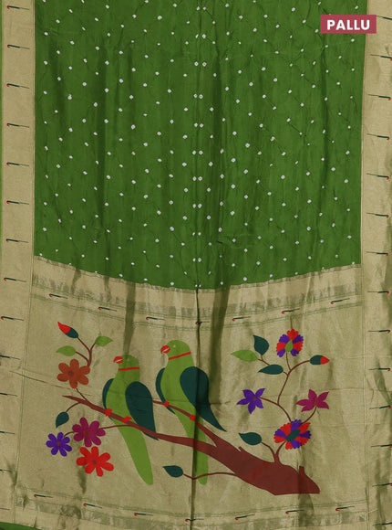 Dola silk saree sap green with allover bandhani prints and muniya butta border