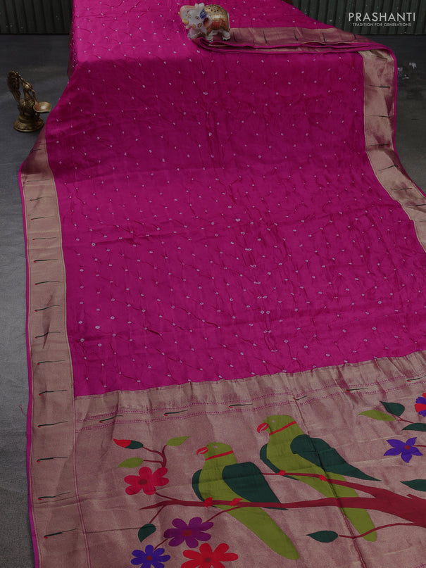 Dola silk saree rani pink with allover bandhani prints and muniya butta border