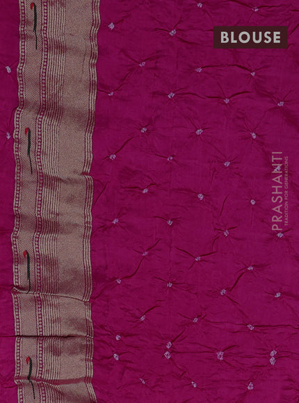 Dola silk saree rani pink with allover bandhani prints and muniya butta border