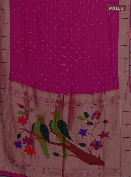Dola silk saree rani pink with allover bandhani prints and muniya butta border