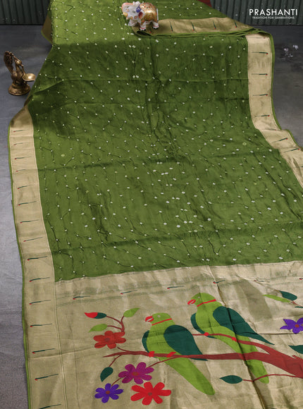 Dola silk saree mehendi green with allover bandhani prints and muniya butta border