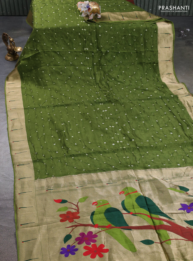 Dola silk saree mehendi green with allover bandhani prints and muniya butta border