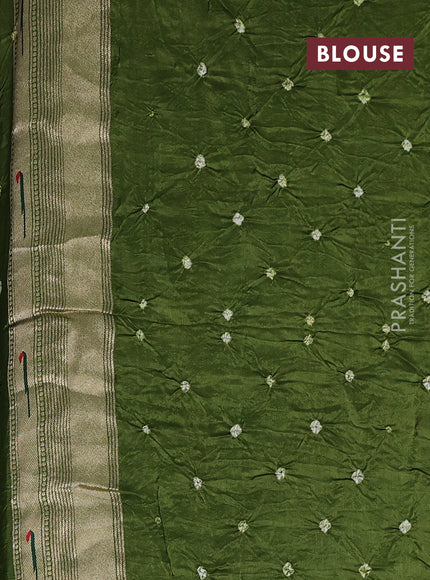 Dola silk saree mehendi green with allover bandhani prints and muniya butta border